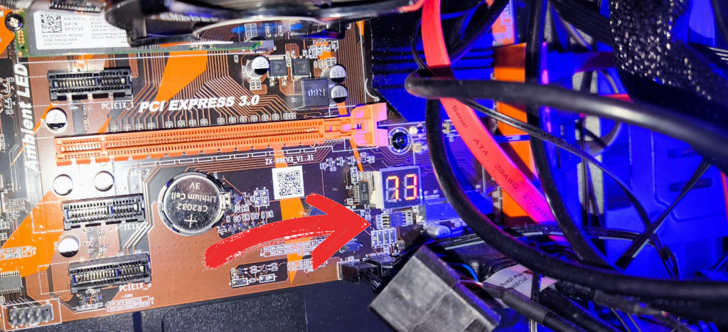 Posizione del chip BIOS sulla scheda madre X99 (ZX-99EV3), situato tra la batteria CMOS e il display di Debug